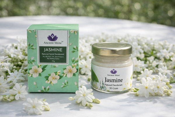 Ancient Shine Jasmine Natural Solid Deodorant with packaging and jar placed on white jasmine flowers, aluminium-free herbal deodorant India