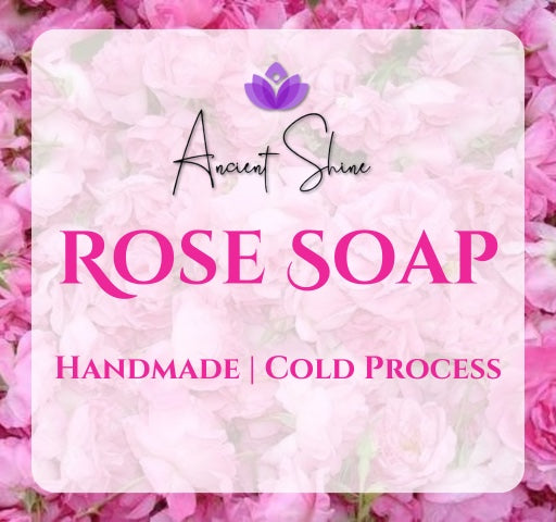 Ancient Shine handmade rose soap with a cold process, surrounded by vibrant pink rose petals