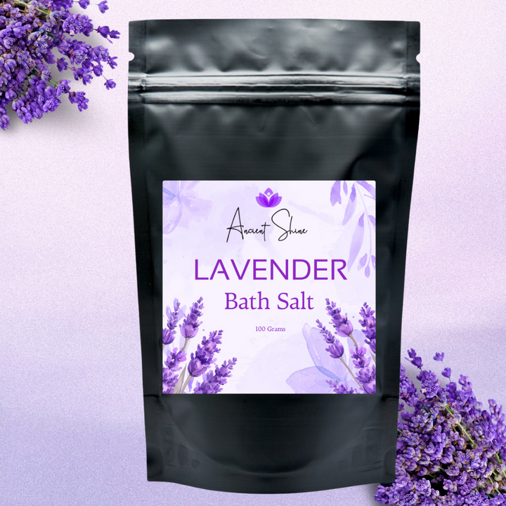 Ancient Shine natural lavender bath salts package with purple lavender flowers background